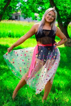 Step into the spotlight with our stunning neon flower tulle wrap skirt, designed to make a statement! This eye-catching piece features a vibrant, neon floral pattern that glows beautifully under blacklight. The wrap design allows for a customizable fit, making it versatile & comfortable to wear. Perfect for dance parties, festivals, or any occasion where fun meets fashion. Summer Beach Skirt With Floral Embroidery, Spring Multicolor Floral Embroidery Skirt, Multicolor Tulle Skirt For Spring, Summer Festival Skirt With Floral Embroidery, Sheer Beach Skirt For Spring, Spring Festival Skirt With Floral Embroidery, Spring Festival Denim Skirt, Neon Flowers, Festival Skirts