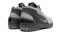 The Nike Air Zoom Generation “Dark Grey” is a clean, neutral colorway of LeBron James’s first signature shoe.  The Zoom Generation was worn by LeBron during his rookie season with the Cleveland Cavaliers in the NBA in 2002 and 2003.  On the upper, light grey leather overlays are paired with a dark grey hairy suede base.  A grey suede Swoosh is found on the lateral side.  Underfoot, the grey Phylon midsole utilizes an encapsulated Air cushioning bag in the heel and Zoom Air unit in the forefoot f Stadium Goods, Grey Suede, Grey Nikes, Grey Shoes, Air Zoom, Nike Air Zoom, Cleveland Cavaliers, Gray Suede, Lebron James