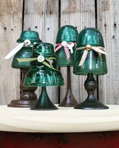 three green lamps are sitting on a table