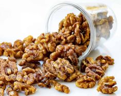 nuts spilling out of a glass jar