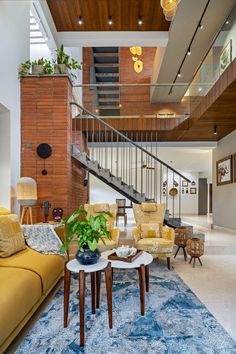 a living room filled with furniture and a stair case