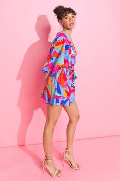 Look stylish and feel comfortable wearing the Charming Inspiration Woven Romper. This romper features a surplice neckline, kimono sleeves and an elasticized waist with a self sash tie. Its lightweight material makes it perfect for the summer, while the print adds a vibrant touch to your wardrobe. Details Self: 100% Polyester Lining: 100% Polyester Size & Fit - Model is 5`8 " And Wearing Size Small - Measurements Taken From Size Small - Approx. Length: 32” Visor Hairstyles, Knitted Swimsuit, Travel Capsule Wardrobe, Kimono Sleeves, Surplice Neckline, Judy Blue Jeans, American Pride, Vintage Inspired Design, Kimono Sleeve