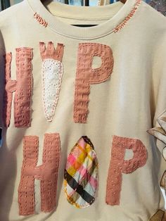 Hip Hop Easter Women's Sweatshirt, Size Large.  Beige/Tan  With, hand -sewn details added, this fun holiday piece would be great to add to your Spring closet! Pink Hip Hop Sweatshirt For Spring, Spring Hip Hop Long Sleeve Sweatshirt, Hip Hop Sweatshirt With Graffiti Print, Spring Harajuku Sweatshirt With Cartoon Print, Easter Sweatshirt, Hip Hop Easter, Spring Closet, Womens Sweatshirts, Hand Sewn