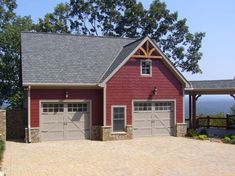 a two car garage with an attached porch