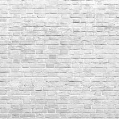 an old white brick wall textured with cement