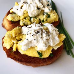 an open face sandwich with scrambled eggs and chives