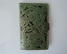 "GREEN PASSPORT WALLET, Tooled Leather Purse, Green Biker Wallet, Full Leather Lining, Vintage Style, Hand Painted Leather, Bifold Wallet. TRAVEL WALLET GREEN / Beautifully Hand Tooled Women's Wallet, Leather Clutch. Stunning Hand Tooled, Hand Crafted in Romantic Floral Swirls. Hand painted leather. Eco Friendly leather, vegetable tanned leather. No 2 pieces will ever be exactly alike. Our dedicated artisan hails from a large family of artists, so each piece is a memorable piece of art. Cotton D Green Leather Wallet With Card Slots, Green Leather Travel Wallet, Green Leather Wallets For Daily Use, Green Leather Bifold Wallet, Daily Use Green Leather Wallet, Vintage Green Wallets With Card Slots, Handmade Green Wallets For Everyday, Handmade Green Wallet For Daily Use, Green Rectangular Wallets For Daily Use