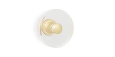 a white and gold door knob on a white wall