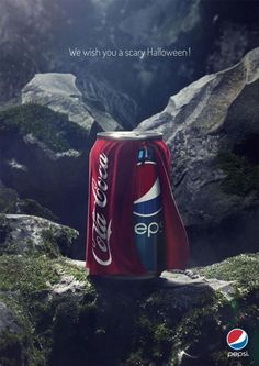 a can of coca - cola on top of a mountain