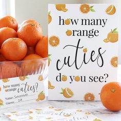 there are many oranges on the table and one has a sign that says how many orange cuties do you see?