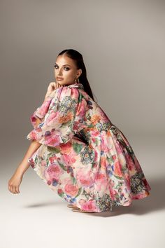 Step into romance with the Wivory Bloom Rose Mini Dress. Featuring a delicate rose bloom print, voluminous puff sleeves, and a dreamy floaty skirt, this dress is your perfect companion for those golden hour moments. The Wivory Bloom Rose Mini Dress is part of our romantic Golden Hour Collection, featuring a stunning rose bloom print and a feminine design that exudes elegance and charm. Beautifully cut from floaty linen organza, it has a V-neckline and a waist-cinching draped bodice. The voluminous puff sleeves complement the mini skirt, creating the prettiest silhouette. The floaty mini skirt is fitted with voluminous layers of the softest lining to maintain its shape beautifully. It zips at the back for easy wear. Where To Wear:Italian city sightseeing, picnics by the river, garden partie Feminine Voluminous Pink Dress, Spring Floral Print Dress With Voluminous Skirt, Elegant Puff Sleeve Dress With Floral Print, Pink Puff Sleeve Dress With Voluminous Fit, Feminine Rose Print Dress, Elegant Floral Print Dresses With Balloon Sleeves, Elegant Dresses With Floral Print And Balloon Sleeves, Feminine Dress With Voluminous Skirt For Garden Party, Feminine Voluminous Dress For Garden Party