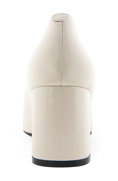 An almond toe defines this classic leather pump elevated by a half-moon block heel and a shock-absorbing sole. Leather upper/synthetic lining and sole Imported Cream Leather Block Heels With Sculpted Heel, Cream Leather High Heel Block Heels, Cream Leather Block Heels With Padded Heel, Leather Block Heels With Platform And Pointed Toe, Cream Closed Toe Leather Block Heels, Cream Leather Closed Toe Block Heels, Cream Leather Round Toe Block Heels, Cream Leather Block Heels With Round Toe, Cream Platform Heels With Square Toe