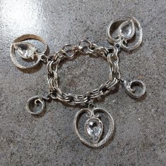 "Excellent condition vintage charm bracelet with big silver tone hearts and glass teardrops. I love the feel of it, makes the hand and wrist feel dainty and decorated. Unsigned.  Approximately 7\" long. Hearts are huge at 1 1/4\" long. Ships for free, same/next day via USPS." Silver Metal Heart Bracelet For Wedding, Vintage Heart Charm Bracelet For Anniversary, Silver Metal Heart Bracelet With Charms, Vintage Silver Charm Bracelet For Wedding, Nickel Free Silver Vintage Heart Bracelet, Vintage Dangle Charm Bracelet, Vintage Silver Bracelets With Heart Charm, Vintage Silver Bracelet With Heart Charm, Vintage Metal Heart Bracelet