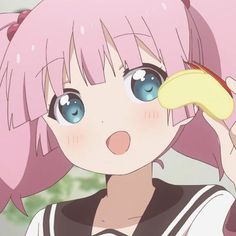 a girl with pink hair holding a banana in her hand