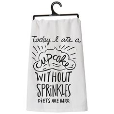 a tea towel hanging on a clothes rack with the words today i'm at a cupcake without sprinkles diets are hard