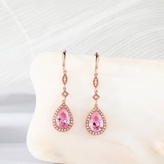 Beautiful drop earrings making for an elegant piece. Each earring is comprised of a highly polished rose gold stud, from which drops a stone set link and a large pear cut pink morganite. The rose gold perfectly accentuates the soft pink of the morganite stone.Carat Weight: 2.37 ctStone Size: 6*9 mmNumber of Stones: 2 Stone Shape: PearStone Color: Fancy PinkCarat Weight: 0.552 ctStone Size: 1.2,1,0.8 mmStone Type: Jeulia® StoneNumber of Stones: 56 Stone Shape: RoundStone Color: Diamond WhiteWeigh Pink Drop Earrings Fine Jewelry, Rose Gold Sterling Silver Teardrop Earrings, Sterling Silver Rose Gold Teardrop Earrings, Elegant Pink Sterling Silver Teardrop Earrings, Rose Gold Dangle Teardrop Earrings, Pink Gold Drop Earrings For Anniversary, Rose Gold Teardrop Pear-shaped Earrings For Anniversary, Rose Gold Pear-shaped Teardrop Earrings For Anniversary, Pear-shaped Rose Gold Teardrop Earrings For Anniversary