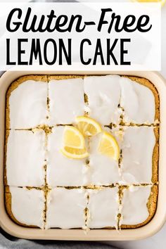 gluten - free lemon cake with white icing and sliced lemons on top