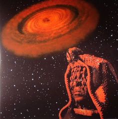 an image of a man in front of a black and orange spiral galaxy with stars