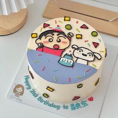 a birthday cake decorated with an image of a boy and his dog