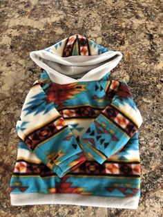 Kids Aztec Blue Winter Sweatshirt For Playtime, Adjustable Hood Hoodie For Playtime In Fall, Fleece Hoodie For Playtime, Multicolor Hooded Fleece Jacket, Winter Hoodie Sweatshirt For Playtime, Cozy Long Sleeve Hoodie For Playtime, Cozy Winter Hoodie For Playtime, Cozy Multicolor Hooded Top, Aztec Hoodie