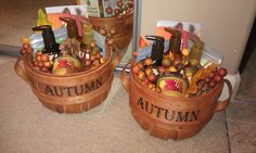 two wooden baskets filled with autumn items