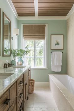 a large bathroom with two sinks and a bathtub