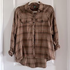 Wild Fable Brand Woman’s Flannel Button Up Blouse - Size Xs Never Worn And Is In Perfect Condition. Has Pockets On Both Sides. Drop In The Back Hangs Lower Than The Front As Shown In Pic. Dark Brown Color. Super Cute With Black Leggings! Brown Flannel, Dark Brown Color, Button Up Blouse, Drop In, Wild Fable, Black Leggings, Brown Color, Dark Brown, Button Down Shirt