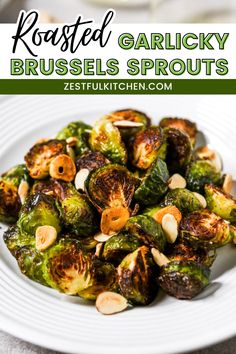 roasted garlicky brussel sprouts on a white plate