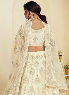 Creme White Pearl Embroidered Wedding Lehenga Choli In usa uk canada Shop Latest Indian Lehenga Choli Collection Creme White Pearl Embroidered Wedding Lehenga Choli Online In Australia, Newzeland This elegant set has a very pretty thread embroidery detailed with zari and pearl work on canned net lehenga with satin lining paired with equally embellished matching net and satin choli and ethnic motifs embroidered net dupatta. Team this beautiful attire with classic pair of heels and golden jeweller Affordable Online Clothing Stores, Wedding Lehenga Choli, Creme White, Indian Wedding Lehenga, Wedding Dresses Indian, Indian Lehenga Choli, Latest Designer Sarees, Net Lehenga, Lehenga Choli Online