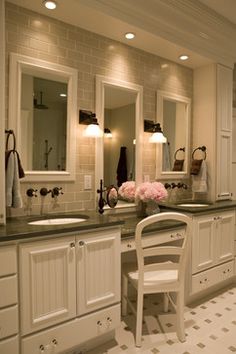 a large bathroom with double sinks and two chairs in front of the mirrors on the wall