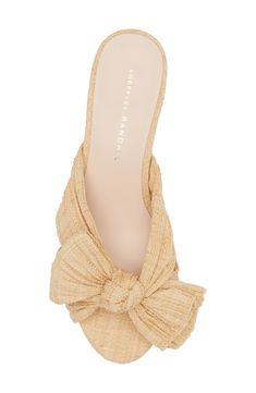 Woven raffia brings stunning texture to a weekend-ready sandal featuring a wrapped column heel and an artfully knotted bow over the toe. 2 1/4" heel (size 8.5) Synthetic upper/cotton lining/leather sole Imported Chic Heels With Wrapped Heel In Straw, Chic Straw Heels With Wrapped Heel, Elegant Natural Heels With Wrapped Heel, Elegant Natural Straw Heels, Elegant Natural Color Straw Heels, Elegant Woven Sandals For Summer, Chic Woven Beige Heels, Chic Beige Woven Heels, Chic Natural Sandals With Wrapped Heel