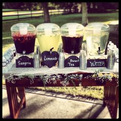 a table topped with cups filled with liquid