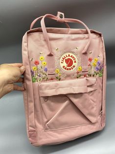 Welcome to my store and choose the perfect hand-embroidered fjallraven kanken backpack   Version & Size + Medium size: 38x27x13cm  + Big size: 42x32x13cm  - Product price includes: hand-embroidered fjallraven kanken backpack and design as shown in the picture - I can make fjallraven kanken backpack hand embroidery patterns according to your ideas - fjallraven kanken backpack will be hand embroidered with thread that won't fade when washed - fjallraven kanken backpack has a small front compartmen Embroidery Kanken Bag, Fjallraven Kanken Backpack Embroidered, Yellow Kanken Backpack, Fjallraven Kanken Yellow, Sunflowers And Lavender, Fjallraven Kanken Orange, Kanken Classic, Kanken Mini, Custom Backpack