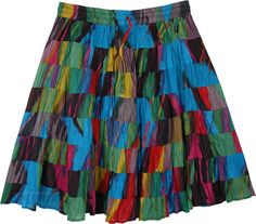 A lined short cotton skirt in blue and green print and made in 8 tiers of increasing circumference which gives it flare, volume and bounce. This skirt will be knee length or shorter or longer depending on how tall you are. It has an elastic waistband and drawstring and the skirt easily fits sizes small to large. Multicolor Cotton Knee-length Skirt, Multicolor Knee-length Cotton Skirt, Multicolor Mini Skirt For Summer, Multicolor Cotton Mini Skirt With Lining, Multicolor Flared Cotton Mini Skirt, Multicolor Cotton Flared Mini Skirt, Multicolor Cotton Ruffled Skirt, Green Cotton Tiered Mini Skirt, Green Tiered Cotton Mini Skirt