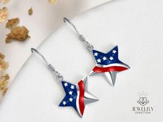 Show off your patriotic spirit with our Star Shape American Flag Hook Sterling Silver Earrings for Women. These eye-catching earrings feature a stunning star design adorned with the iconic American flag, making them a perfect accessory for any patriotic occasion. Crafted from high-quality sterling silver, they offer a brilliant shine and lasting durability. Ideal for the 4th of July, Memorial Day, or USA Flag Day, these earrings are a stylish way to celebrate your love for the country. The easy- White Gold Pearl Earrings, Silver Pearl Drop Earrings, Pentagram Design, Patriotic Earrings, Patriotic Jewelry, Pentagram Pendant, Flag Day, Sterling Silver Drop Earrings, Earring For Women