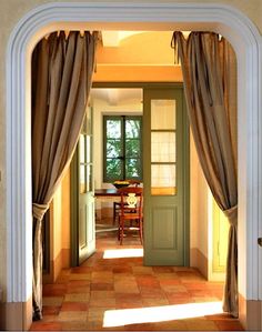 an open door leading to a dining room