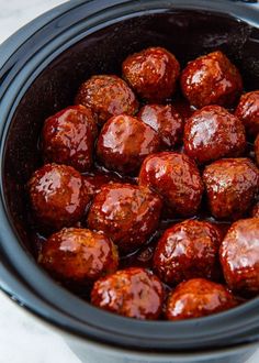 the meatballs are cooked and ready to be eaten in the crockpots