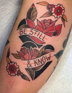 a woman's arm with tattoos on it that says be still and know