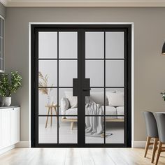 an open glass door leading to a living room