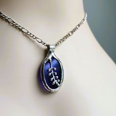 If you're looking for the perfect gift for Mom, this stained glass necklace for women is a great option. The cobalt blue glass pendant is absolutely gorgeous and gives off such a vibrant look. Hand crafted in USA, it's a piece that really stands out. Whether it's for a birthday gift or just because, this is definitely Mother's choice jewelry that she'll love wearing. Who doesn't love stained glass? Feminine oval shape with a little soldered handwork on top. I can make this is in most any color. Blue Recycled Glass Jewelry For Gift, Blue Recycled Glass Jewelry As Gift, Blue Nickel Free Necklace With Recycled Glass, Blue Recycled Glass Nickel-free Necklace, Stained Glass Necklace, Tiffany Style, Perfect Gift For Mom, Glass Necklace, Glass Pendant