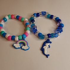 Kandi Rave Pony Bead Stretchy Cord Bracelets , Teal Blue Pinks Rainbow Charm, Blues Clear Star Bead Dolphin Charm,Handmade Pony Beads Elastic Cord One-Size-Fits-Most Blue Kandi Bracelets, Blue Kandi, Dinosaur Kandi Bracelet, Kandi Bracelets Scene, Beyond Wonderland Kandi, Rave Bracelets, Diy Kandi Bracelets, Diy Kandi, Kandi Kid