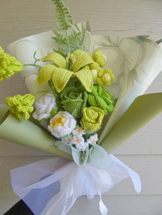 a bouquet of flowers sitting on top of a white chair