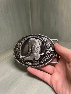 This black and silver cowboy boot belt buckle has been previously used but is still in good condition and is ready to go to a new home. As far as I know there's no brand Joe Cross, Cowboy Belt Buckles, Cowboy Belt, Black Cowboy, Cowboy Boot, Suspender Belt, Black And Silver, Cute Dolls, Belt Buckle