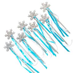 six snowflake hair pins with blue ribbons and bows on them, set of five