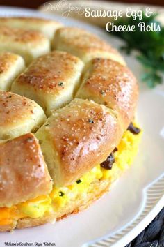 an egg and cheese roll on a white plate