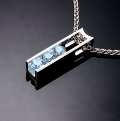 "A delicate aquamarine pendant design with clean, contemporary lines, perfect for any occasion. Argentium Chain Included. Ready to ship! Style #3503 ( IMPORTANT - PLEASE READ 1. AND 2 BELOW ) 1.) Included in the price is an Argentium silver chain appropriate for the pendant chosen. You can choose from 16\", 18\" or 20\" length at checkout. 2.) PLEASE LOOK AT THE MEASUREMENTS CAREFULLY. Some photos have been enlarged to show detail, while others have been minimized to fit the frame. Actual size c White Sapphire Necklace, Aquamarine Birthstone, Holiday Necklace, Yucca Valley, Aquamarine Pendant, Aquamarine Necklace, Cz Necklace, Necklace Diamond, Jewelry Blue