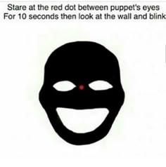 a black mask with red eyes and the words, you stare at the red dot between puppet's eyes