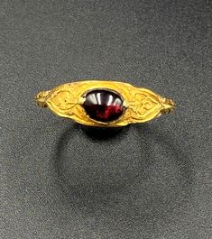 The Beautiful Antique Gold Ring Probably From South East Regions. Beautiful Garnet Gems Stone Is Place In The Ring. Size Details Pictures Are Listed Above. The Size Of This Ring Is USA 12. The Weight Is 4.55 Grams. 18 karat Gold .Test Certificate Available On Request Of Customer. Free And Fast Shipping World Wide. Ceremonial Byzantine Jewelry With Cabochon, Ceremonial Byzantine Cabochon Jewelry, Hallmarked Byzantine Jewelry For Formal Occasions, Elegant Round Ruby Intaglio Ring, Elegant Round Ruby Ring With Intaglio Detail, Formal Byzantine Ring Jewelry, Formal Byzantine Engraved Rings, Formal Byzantine Style Engraved Rings, Byzantine Ring With Cabochon