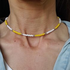 This is a 14 inch necklace using Czech 8/0 Opaque Yellow Luster and OP White Ceylon and Duracoat Galvanized Silver(won't wear off) seed beads. It is finished off with a silver plated lobster clasp and jump rings.  If you have a preference for a different length, just ask. I can always create one just for you. This necklace looks great on its own or layered with other necklaces. Also great for everyday wear. To maintain quality of necklace, keep dry(do not wear while swimming, showering, etc.) an Yellow Beaded Necklace With Tiny Beads For Gift, Yellow Beaded Necklace With Tiny Beads As Gift, Yellow Tiny Beads Necklace As Gift, Yellow Necklaces With Tiny Beads As Gift, Dainty Handmade Yellow Jewelry, Handmade Minimalist Yellow Jewelry, Handmade Yellow Minimalist Jewelry, Yellow Tiny Beads Necklace For Gift, Yellow Necklaces With Tiny Beads For Gifts