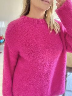 "MOHAIR HOT PINK SWEATER  This hot pink mohair sweater is soft and comfy! It is 100% hand knitted with mohair wool.  COMPOSITION * 100% hand knit * 90% mohair, 10% vegan angora blend * Super soft, not itchy  * Long sleeves * Drop shoulder * Plain design 💗The sweater is made in order and it can be knit according to your size.  It will be shipped in 7-10 days. SIZE The sweater's measurements in the photos are below.  The model is 170 cm/ 67\" and size M. -Chest: 24 inches (61 cm) -Sleeve: 21 inches (54 cm) -Length: 26 inches (65 cm) 🫧CARE * Turn your sweater inside out  * Use a mild, liquid detergent * Wash delicate wool set in cold water * Do not bleach * Dry flat //Pink Knit Sweater, Mohair Fuschia Sweater, Mohair Pullover, Handknit Oversized Jumper, Handknit Christmas Gift, Pink Knit Ov Pink Knitted Sweater For Cold Weather, Cozy Crew Neck Knitting Pattern In Soft Knit, Cozy Crew Neck Soft Knit Pattern, Oversized Crew Neck Knitting Pattern For Winter, Mohair Sweater With Soft Knit And Crew Neck, Winter Oversized Crew Neck Knitting Pattern, Cozy Pink Soft Knit Pattern, Oversized Winter Crew Neck Knitting Pattern, Oversized Pink Knitted Sweater